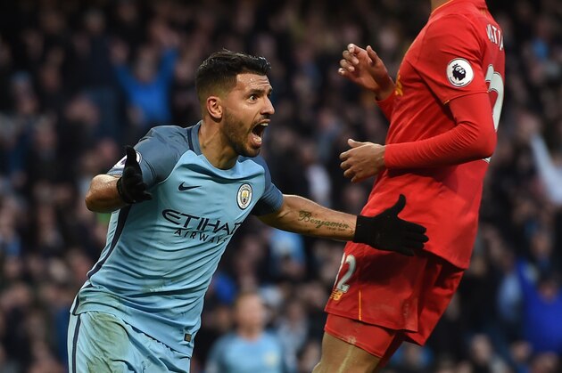 Manchester City's Argentinian striker Sergio Aguero (L) celebrates after scoring during the English Premier League football match between Manchester City and Liverpool at the Etihad Stadium in Manchester, north west England, on March 19, 2017. / AFP PHOTO / PAUL ELLIS / RESTRICTED TO EDITORIAL USE. No use with unauthorized audio, video, data, fixture lists, club/league logos or 'live' services. Online in-match use limited to 75 images, no video emulation. No use in betting, games or single club/league/player publications.  /         (Photo credit should read PAUL ELLIS/AFP/Getty Images)