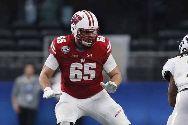Jan 2, 2017; Arlington, TX, USA; Wisconsin Badgers offensive lineman Ryan Ramczyk (65) blocks Western Michigan Broncos defensive end Keion Adams (1) in the third quarter at AT&T Stadium. The Badgers won 24-16. Mandatory Credit: Tim Heitman-USA TODAY Sports