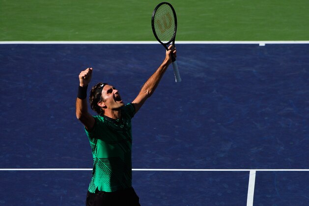 INDIAN WELLS, CA - MARCH 19:  Roger Federer of Switzerland celebrates after defeating Stan Wawrinka of Switzerland in the men's final on day 14 during the BNP Paribas Open at Indian Wells Tennis Garden on March 19, 2017 in Indian Wells, California.  (Photo by Alex Goodlett/Getty Images)