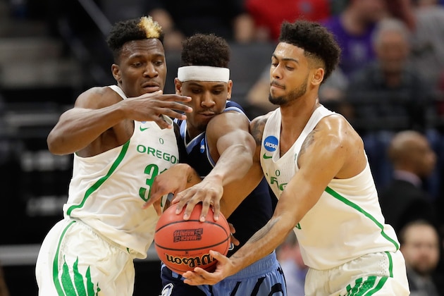 SACRAMENTO, CA - MARCH 19:  Teammates Dylan Ennis #31 and Tyler Dorsey #5 of the Oregon Ducks go after a loose ball against E.C. Matthews #0 of the Rhode Island Rams during the second round of the 2017 NCAA Men's Basketball Tournament at Golden 1 Center on March 19, 2017 in Sacramento, California.  (Photo by Jamie Squire/Getty Images)