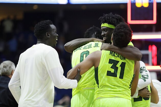 TULSA, OK - MARCH 19: Johnathan Motley #5 of the Baylor Bears celebrates with his teammates Terry Maston #31 and Jo Lual-Acuil Jr. #0 after defeating the USC Trojans during the second round of the 2017 NCAA Men's Basketball Tournament at BOK Center on March 19, 2017 in Tulsa, Oklahoma.  (Photo by Ronald Martinez/Getty Images)