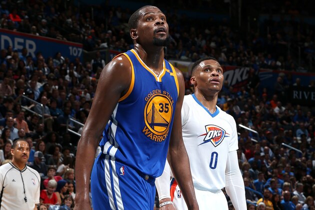 OKLAHOMA CITY, OK - FEBRUARY 11: Russell Westbrook #0 of the Oklahoma City Thunder and Kevin Durant #35 of the Golden State Warriors looks on during the game on February 11, 2017 at Chesapeake Energy Arena in Oklahoma City, Oklahoma. NOTE TO USER: User expressly acknowledges and agrees that, by downloading and or using this photograph, User is consenting to the terms and conditions of the Getty Images License Agreement. Mandatory Copyright Notice: Copyright 2017 NBAE (Photo by Layne Murdoch/NBAE via Getty Images)