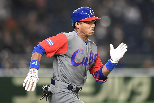TOKYO, JAPAN - MARCH 12:  Yoelkis Cespedes #16 of Cuba runs after hitting a grounder to shortstop in the fifth inning during the World Baseball Classic Pool E Game One between Cuba and Israel at Tokyo Dome on March 12, 2017 in Tokyo, Japan.  (Photo by Matt Roberts/Getty Images)