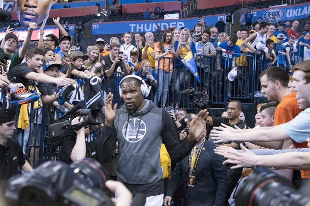 OKLAHOMA CITY, OK - FEBRUARY 11: Kevin Durant #35 of the Golden State Warriors walks onto the court for practice during before a NBA game against the Oklahoma City Thunder at the Chesapeake Energy Arena on February 11, 2017 in Oklahoma City, Oklahoma. NOTE TO USER: User expressly acknowledges and agrees that, by downloading and or using this photograph, User is consenting to the terms and conditions of the Getty Images License Agreement. (Photo by J Pat Carter/Getty Images)