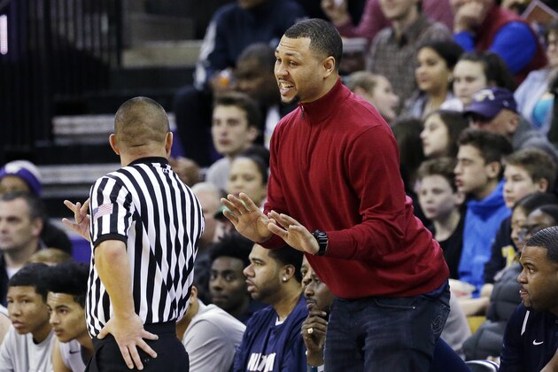 In this photo taken Feb. 8, 2017, Nathan Hale High School head coach and former NBA all-star Brandon Roy talks with an official during a Metro League basketball game, in Seattle. Roy's team features Michael Porter Jr., the nation's No. 1 high school recruit for the nation's No. 1 high school team. (AP Photo/Elaine Thompson)