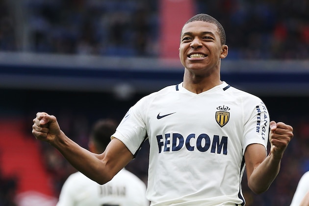 Monaco's French forward Kylian Mbappe Lottin celebrates after scoring a goal during the French L1 football match between Caen (SMC) and Monaco (AS), on March 19, 2017 at the Michel d'Ornano stadium, in Caen, northwestern France. / AFP PHOTO / CHARLY TRIBALLEAU        (Photo credit should read CHARLY TRIBALLEAU/AFP/Getty Images)