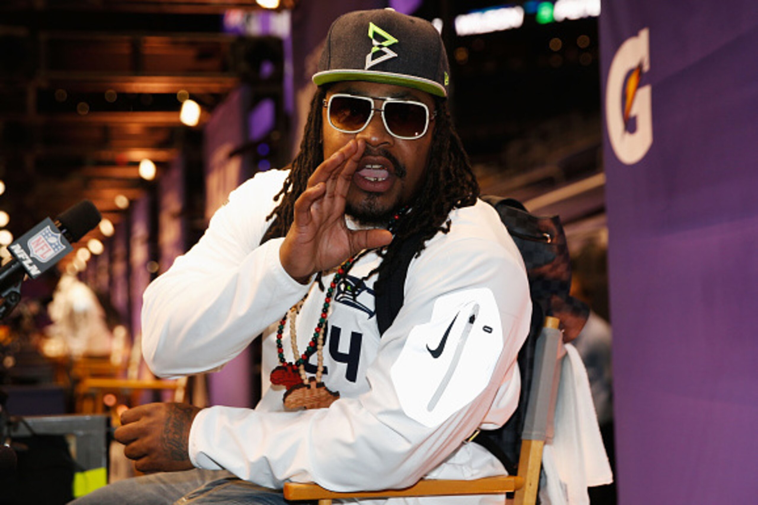 PHOENIX, AZ - JANUARY 27:  Marshawn Lynch #24 of the Seattle Seahawks addresses the media at Super Bowl XLIX Media Day Fueled by Gatorade inside U.S. Airways Center on January 27, 2015 in Phoenix, Arizona.  (Photo by Christian Petersen/Getty Images)