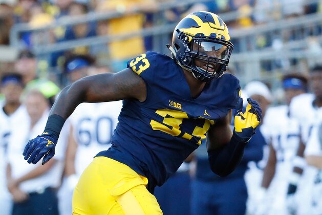 ANN ARBOR, MI - SEPTEMBER 24: Defensive end Taco Charlton #33 of the Michigan Wolverines rushes quarterback Trace McSorley #9 of the Penn State Nittany Lions during the fourth quarter of the game at Michigan Stadium on September 24, 2016 in Ann Arbor, Michigan. Michigan defeated the Penn State 49-10. (Photo by Leon Halip/Getty Images)
