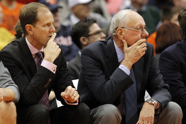 Syracuse’s assistant coach Mike Hopkins, left, and Syracuse head coach Jim Boeheim, right, watch the action from the bench in the first half of an NCAA college basketball game against Elon in Syracuse, N.Y., Saturday, Nov. 21, 2015. (AP Photo/Nick Lisi)
