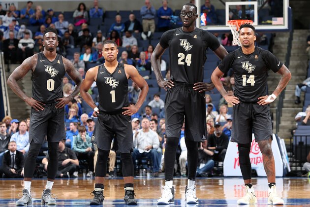 MEMPHIS, TN - JANUARY 22: Tank Efianayi #0, B.J. Taylor #1 and Tacko Fall #24and Nick Banyard #14 of the Central Florida Knights look on against the Memphis Tigers on January 22, 2017 at FedExForum in Memphis, Tennessee. Memphis defeated Central Florida 70-65. (Photo by Joe Murphy/Getty Images)