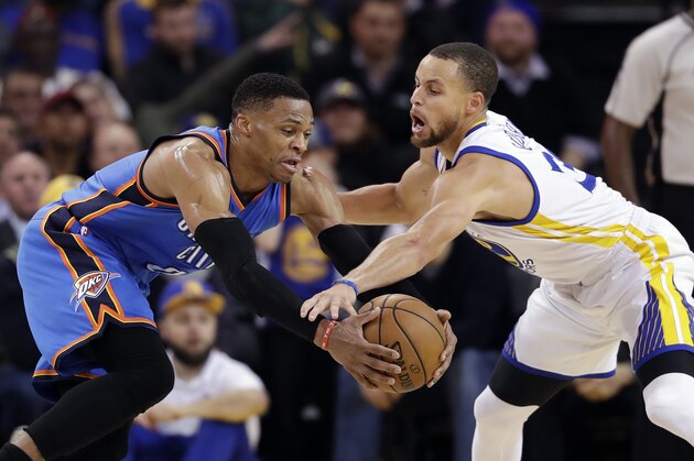 Golden State Warriors' Stephen Curry, right, defends Oklahoma City Thunder's Russell Westbrook during the second half of an NBA basketball game Wednesday, Jan. 18, 2017, in Oakland, Calif. (AP Photo/Marcio Jose Sanchez)
