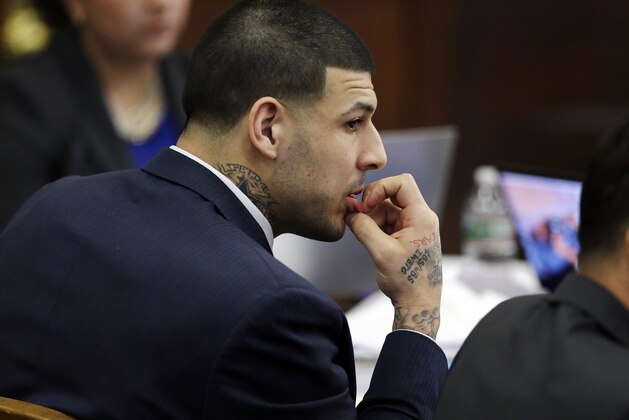 Defendant Aaron Hernandez listens during his double murder trial in Suffolk Superior Court, Wednesday, March 15, 2017, in Boston. Hernandez is on trial for the July 2012 killings of Daniel de Abreu and Safiro Furtado who he encountered in a Boston nightclub. The former New England Patriots NFL football player is already serving a life sentence in the 2013 killing of semi-professional football player Odin Lloyd. (AP Photo/Elise Amendola, Pool)