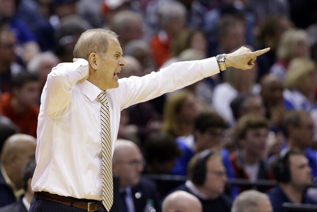 Michigan head coach John Beilein gestures from the bench as his team played Louisville during the second half of a second-round game in the men’s NCAA college basketball tournament in Indianapolis, Sunday, March 19, 2017. Michigan defeated Louisville 73-69. (AP Photo/Michael Conroy)