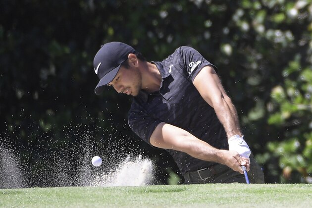 Jason Day, of Australia, hits out of a bunker onto the first green during the third round of the Arnold Palmer Invitational golf tournament in Orlando, Fla., Saturday, March 18, 2017. (AP Photo/Phelan M. Ebenhack)