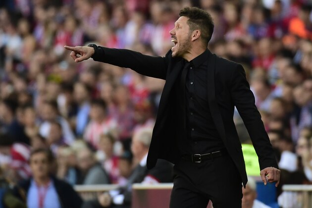 Atletico Madrid's Argentinian coach Diego Simeone gestures during the Spanish league football match Club Atletico de Madrid vs Sevilla FC at the Vicente Calderon stadium in Madrid on March 19, 2017. / AFP PHOTO / PIERRE-PHILIPPE MARCOU        (Photo credit should read PIERRE-PHILIPPE MARCOU/AFP/Getty Images)