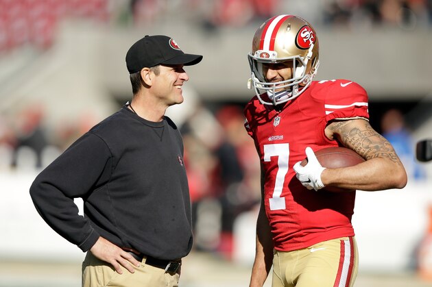 SANTA CLARA, CA - DECEMBER 28:  Head coach Jim Harbaugh of the San Francisco 49ers talks with Colin Kaepernick #7 before their game against the Arizona Cardinals at Levi's Stadium on December 28, 2014 in Santa Clara, California.  (Photo by Ezra Shaw/Getty Images)
