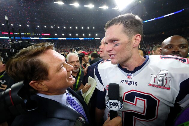 HOUSTON, TX - FEBRUARY 05:  Tom Brady #12 of the New England Patriots is interviewed on the field after defeating the Atlanta Falcons 34-28 in overtime to win Super Bowl 51 at NRG Stadium on February 5, 2017 in Houston, Texas.  (Photo by Tom Pennington/Getty Images)