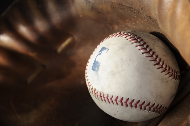 GLENDALE, AZ - FEBRUARY 19:  A batting practice baseball rests in a catchers mitt during Chicago White Sox spring training workouts on February 19, 2014 at The Ballpark at Camelback Ranch in Glendale, Arizona. (Photo by Ron Vesely/MLB Photos via Getty Images)  ***