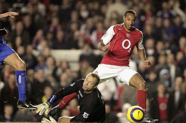 LONDON - DECEMBER 4:  Thierry Henry of Arsenal beats Maik Taylor of Birmingham City to score Arsenals second goal during the Barclays Premiership match between Arsenal and Birmingham City at Highbury on December 4, 2004 in London, England.  (Photo by Phil Cole/Getty Images)