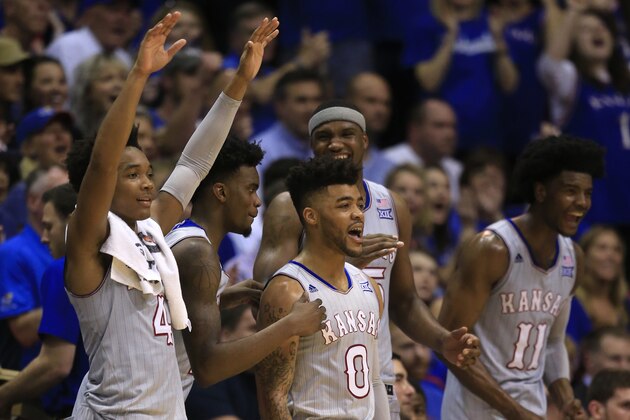 Kansas players Devonte' Graham (4), Lagerald Vick (2), Frank Mason III (0), Carlton Bragg Jr. (15) and Josh Jackson (11) during the second half of an NCAA college basketball game against TCU in Lawrence, Kan., Wednesday, Feb. 22, 2017. Kansas defeated TCU 87-68. The Jayhawks clinched at least a tie for their 13th straight Big 12 title. (AP Photo/Orlin Wagner)