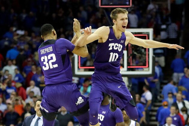 KANSAS CITY, MO - MARCH 09:  Vladimir Brodziansky #10 and Karviar Shepherd #32 of the TCU Horned Frogs celebrate as the Horned Frogs defeat the Kansas Jayhawks 85-82 to win the quarterfinal game of the Big 12 Basketball Tournament at the Sprint Center on March 9, 2017 in Kansas City, Missouri.  (Photo by Jamie Squire/Getty Images)