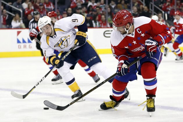 Nashville Predators left wing Filip Forsberg (9), from Sweden, pursues Washington Capitals left wing Alex Ovechkin (8), from Russia, who skates with the puck during the second period of an NHL hockey game, Thursday, March 16, 2017, in Washington. (AP Photo/Alex Brandon)