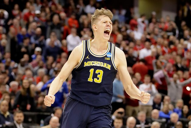 INDIANAPOLIS, IN - MARCH 19:  Moritz Wagner #13 of the Michigan Wolverines celebrates against the Louisville Cardinals during the second round of the NCAA Basketball Tournament at Bankers Life Fieldhouse on March 19, 2017 in Indianapolis, Indiana.  (Photo by Andy Lyons/Getty Images)