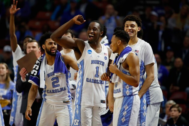 GREENVILLE, SC - MARCH 17:  Theo Pinson #1, Justin Jackson #44, Joel Berry II #2 and Nate Britt #0 of the North Carolina Tar Heels celebrate from the bench in the second half against the Texas Southern Tigers during the first round of the 2017 NCAA Men's Basketball Tournament at Bon Secours Wellness Arena on March 17, 2017 in Greenville, South Carolina. North Carolina Tar Heels won 103-64.  (Photo by Gregory Shamus/Getty Images)