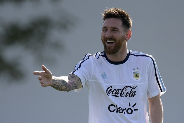 Argentina's forward Lionel Messi laughs during a training session in Ezeiza, Buenos Aires, on March 21, 2017 ahead of their World Cup South American qualifier football matches against Chile and Venezuela.  / AFP PHOTO / Juan MABROMATA        (Photo credit should read JUAN MABROMATA/AFP/Getty Images)