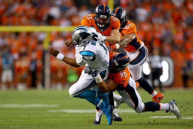 DENVER, CO - SEPTEMBER 08:  Quarterback Cam Newton #1 of the Carolina Panthers is hit by defensive end Derek Wolfe #95 and defensive end Jared Crick #93 of the Denver Broncos in the first quarter at Sports Authority Field at Mile High on September 8, 2016 in Denver, Colorado.  (Photo by Justin Edmonds/Getty Images)
