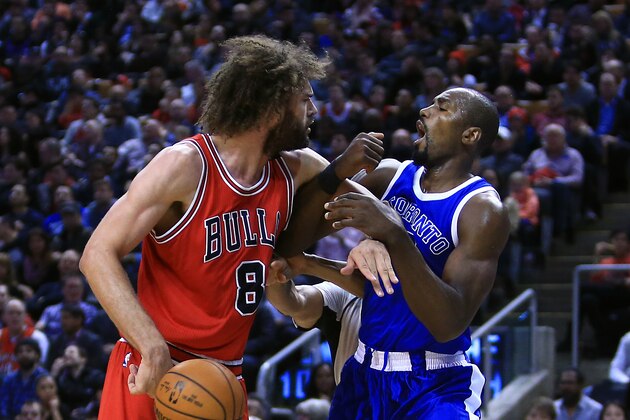TORONTO, ON - MARCH 21:  Robin Lopez #8 of the Chicago Bulls fights with Serge Ibaka #9 of the Toronto Raptors during the second half of an NBA game at Air Canada Centre on March 21, 2017 in Toronto, Canada.  NOTE TO USER: User expressly acknowledges and agrees that, by downloading and or using this photograph, User is consenting to the terms and conditions of the Getty Images License Agreement.  (Photo by Vaughn Ridley/Getty Images)