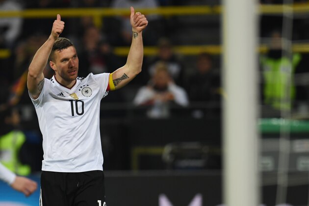 Germany's midfielder Lukas Podolski reacts during a friendly football match between Germany and England on March 22, 2017 in Dortmund, western Germany. 
It is Lukas Podolski's last match with the German team. / AFP PHOTO / PATRIK STOLLARZ        (Photo credit should read PATRIK STOLLARZ/AFP/Getty Images)