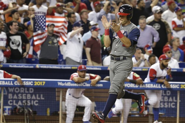 United States' Ian Kinsler runs home to score when Adam Jones reached on a throwing error by Dominican Republic center fielder Starling Marte during the third inning in a first-round game of the World Baseball Classic, Saturday, March 11, 2017, in Miami. (AP Photo/Lynne Sladky)