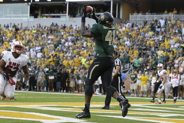 Baylor tight end Tre'Von Armstead (41) catches a touchdown in front of SMU linebacker Cameron Nwosu (52) during the first half of an NCAA college football game Sunday, Aug. 31, 2014, in Waco, Texas. (AP Photo/LM Otero)