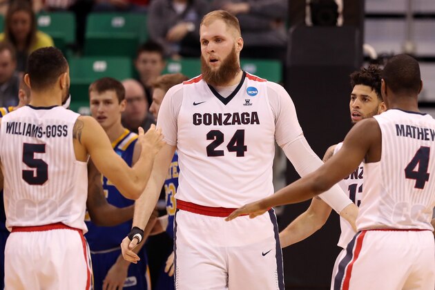 SALT LAKE CITY, UT - MARCH 16: Przemek Karnowski #24 of the Gonzaga Bulldogs celebrates with Nigel Williams-Goss #5 and Jordan Mathews #4 after a play in the second half against the South Dakota State Jackrabbits during the first round of the 2017 NCAA Men's Basketball Tournament at Vivint Smart Home Arena on March 16, 2017 in Salt Lake City, Utah.  (Photo by Christian Petersen/Getty Images)