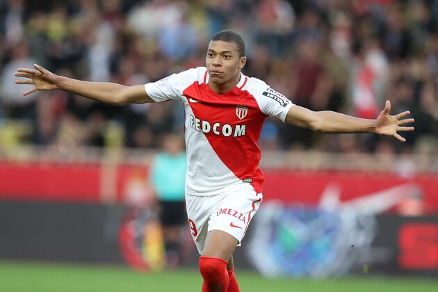 Monaco's French forward Kylian Mbappe celebrates after scoring a goal during the French L1 football match Monaco (ASM) vs Bordeaux (GB) on March 11, 2017 at the Louis II Stadium in Monaco.   / AFP PHOTO / VALERY HACHE        (Photo credit should read VALERY HACHE/AFP/Getty Images)
