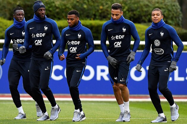 (From L) French national football team's defender Benjamin Mendy, midfielder Tiemoue Bakayoko, midfielder Thomas Lemar, midfielder Corentin Tolisso and forward Kylian Mbappe run during a training session on March 20, 2017, in Clairefontaine near Paris as part of the team's preparation for the upcoming World Cup 2018 qualifiers.   / AFP PHOTO / FRANCK FIFE        (Photo credit should read FRANCK FIFE/AFP/Getty Images)