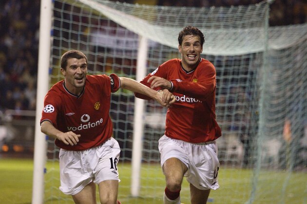 2 Apr 2002: Ruud van Nistelrooy of Manchester United celebrates scoring the second goal with team-mate Roy Keane during the UEFA Champions League quarter-final first leg match between Deportivo La Coruna and Manchester United played at Estadio Municipalde Riazor, in La Coruna, Spain. Manchester United won the match 2-1. DIGITAL IMAGE. \ Mandatory Credit: Laurence Griffiths/Getty Images 2 Apr 2002: Ruud van Nistelrooy of Manchester United celebrates scoring the second goal with team-mate Roy Keane during the UEFA Champions League quarter-final first leg match between Deportivo La Coruna and Manchester United played at Estadio Municipalde Riazor, in La Coruna, Spain. Manchester United won the match 2-1. DIGITAL IMAGE. \ Mandatory Credit: Laurence Griffiths/Getty Images