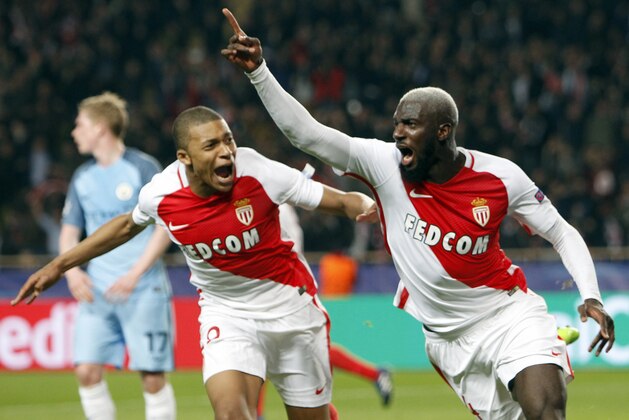 Monaco's Tiemoue Bakayoko, right, celebrates his side side's 3rd goal with Kylian Mbappe during a Champions League round of 16 second leg soccer match between Monaco and Manchester City at the Louis II stadium in Monaco, Wednesday March 15, 2017. (AP Photo/Claude Paris)