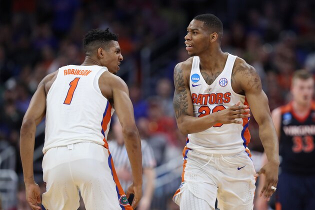 ORLANDO, FL - MARCH 18:  Devin Robinson #1 and Justin Leon #23 of the Florida Gators react in the first half against the Virginia Cavaliers during the second round of the 2017 NCAA Men's Basketball Tournament at the Amway Center on March 18, 2017 in Orlando, Florida.  The Florida Gators won 65-39.  (Photo by Rob Carr/Getty Images)