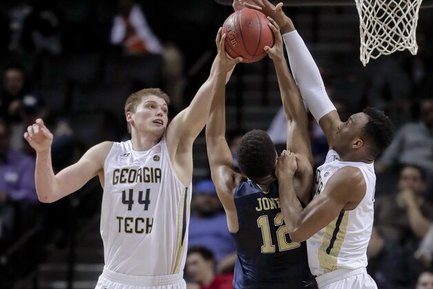 Georgia Tech center Ben Lammers (44) and guard Josh Okogie (5) block a shot attempt by Pittsburgh guard Chris Jones (12) during the second half of an NCAA college basketball game in the first round of the ACC tournament, Tuesday, March 7, 2017, in New York. Pittsburgh won 61-59. (AP Photo/Julie Jacobson)