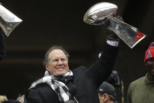 New England Patriots head coach Bill Belichick holds up a Super Bowl trophy as he addresses the crowd during a rally Tuesday, Feb. 7, 2017, in Boston, to celebrate Sunday's 34-28 win over the Atlanta Falcons in the NFL Super Bowl 51 football game in Houston. (AP Photo/Elise Amendola)