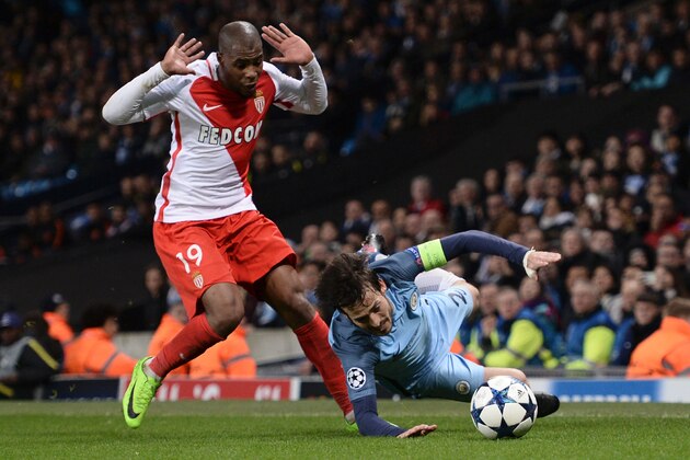 Manchester City's Spanish midfielder David Silva (R) goes down in a challenge with Monaco's French defender Djibril Sidibe (L) during the UEFA Champions League Round of 16 first-leg football match between Manchester City and Monaco at the Etihad Stadium in Manchester, north west England on February 21, 2017. / AFP / Oli SCARFF        (Photo credit should read OLI SCARFF/AFP/Getty Images)