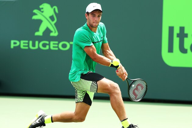 KEY BISCAYNE, DE - MARCH 23:  Borna Coric of Croatia returns a shot against Marcel Granollers of Spain  during Day 4 of the Miami Open at Crandon Park Tennis Center on March 23, 2017 in Key Biscayne, Florida.  (Photo by Al Bello/Getty Images)
