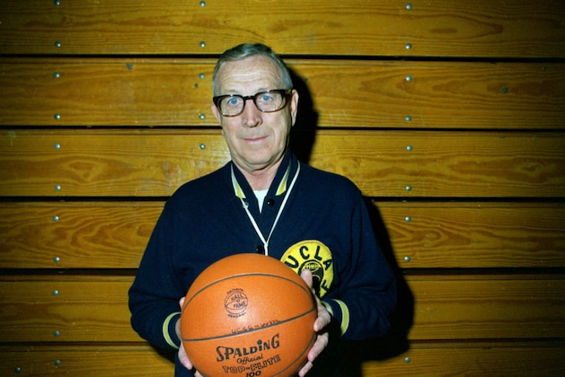 John Wooden, UCLA Basketball Coach , posing holding pall
