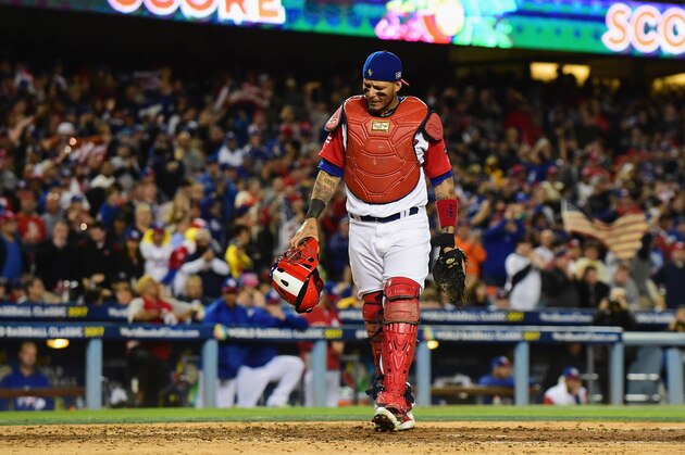 LOS ANGELES, CA - MARCH 22:  Yadier Molina #4 of team Puerto Rico reacts after Ian Kinsler #3 (not pictured) of team United States scored a run for a 3-0 lead over Puerto Rico in the fifth inning during Game 3 of the Championship Round of the 2017 World Baseball Classic at Dodger Stadium on March 22, 2017 in Los Angeles, California.  (Photo by Harry How/Getty Images)