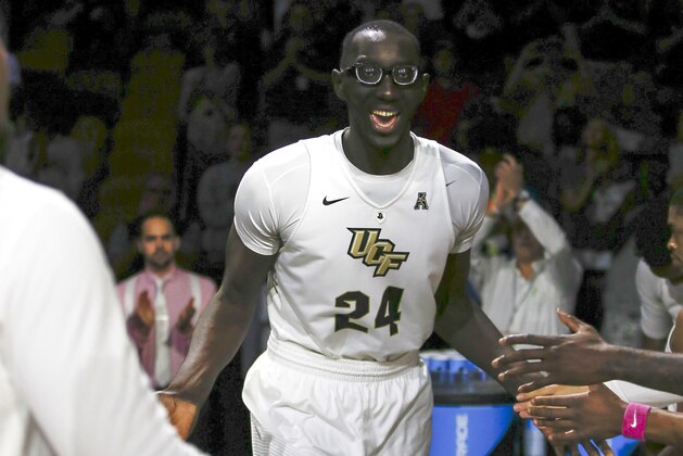 Central Florida center Tacko Fall (24) is introduced before an NCAA college basketball game against Cincinnati in Orlando, Fla., on Sunday, Feb. 26, 2017. (AP Photo/Reinhold Matay) Central Florida center Tacko Fall (24) is introduced before an NCAA college basketball game against Cincinnati in Orlando, Fla., on Sunday, Feb. 26, 2017. (AP Photo/Reinhold Matay)