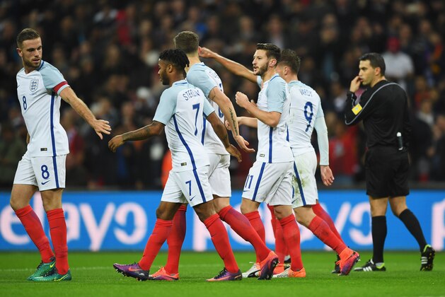 LONDON, ENGLAND - NOVEMBER 15:  Adam Lallana of England (11) celebrates with team mates after scoring the opening goal during the international friendly match between England and Spain at Wembley Stadium on November 15, 2016 in London, England.  (Photo by Shaun Botterill/Getty Images)