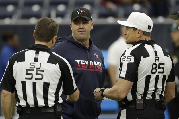 Houston Texans head coach Bill O'Brien, center, talks with side judge Alex Kemp (55) and referee Ed Hochuli (85) before an NFL football game Sunday, Dec. 18, 2016, in Houston. (AP Photo/David J. Phillip)