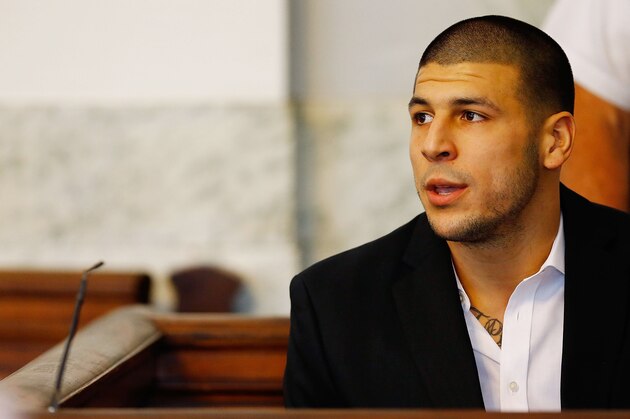 NORTH ATTLEBORO, MA - AUGUST 22: Aaron Hernandez sits in the courtroom of the Attleboro District Court during his hearing on August 22, 2013 in North Attleboro, Massachusetts. Former New England Patriot Aaron Hernandez has been indicted on a first-degree murder charge for the death of Odin Lloyd. (Photo by Jared Wickerham/Getty Images)